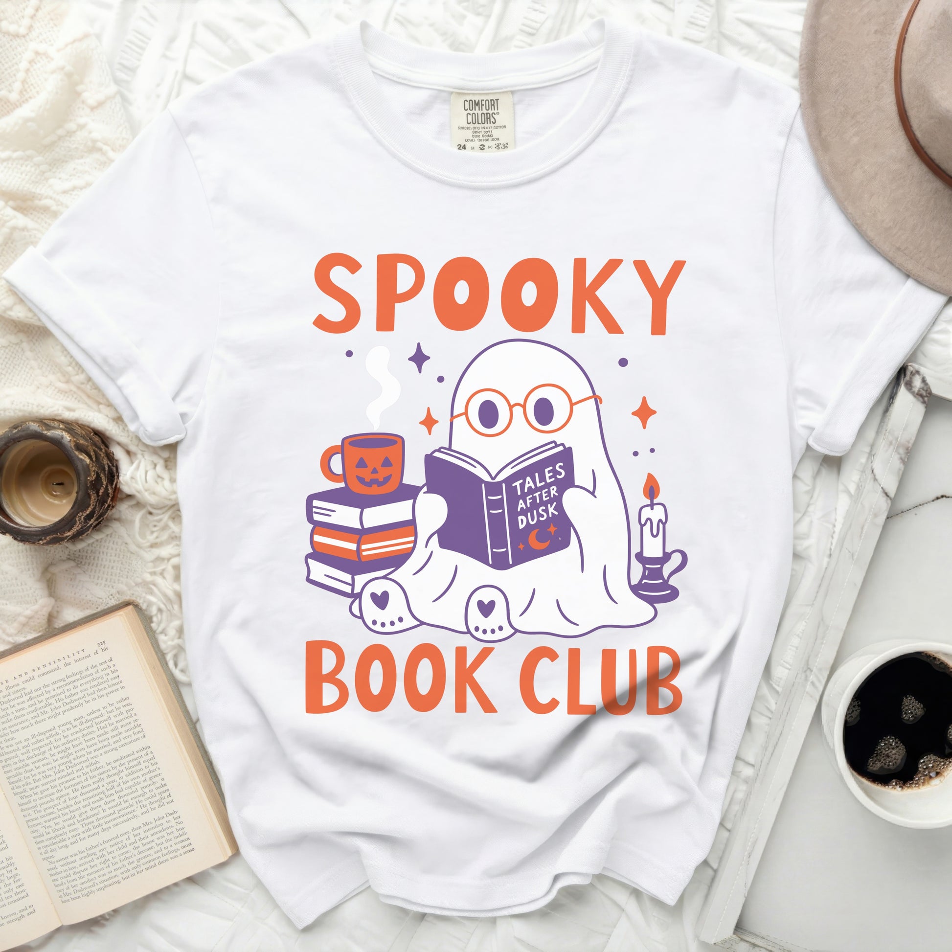 White t-shirt with graphic of ghost reading a book under the text SPOOKY BOOK CLUB.