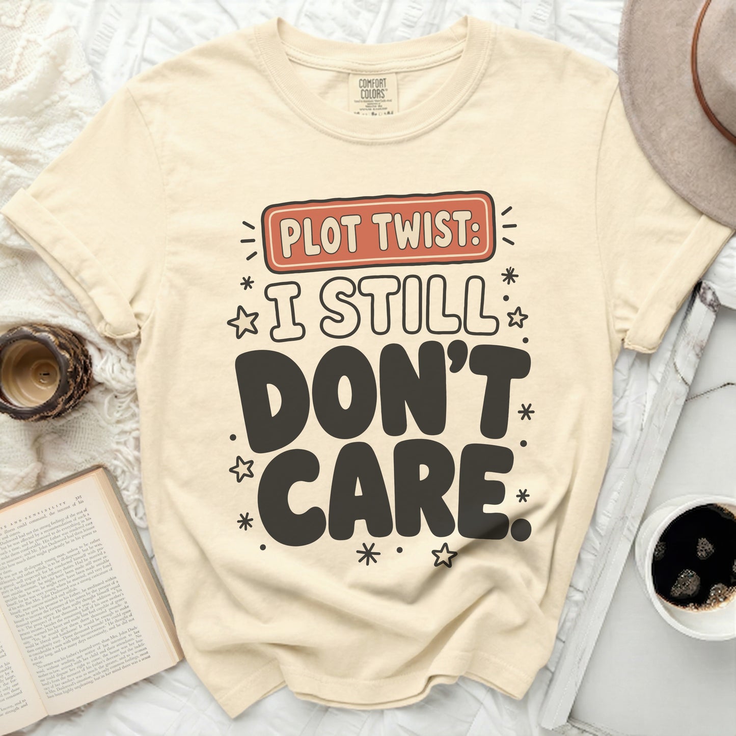 Comfort Colors t-shirt with "Plot Twist: I Still Don't Care" slogan.