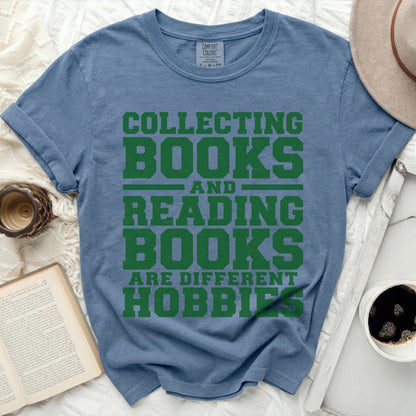Blue t-shirt with green text "Collecting Books and Reading Books Are Different Hobbies".