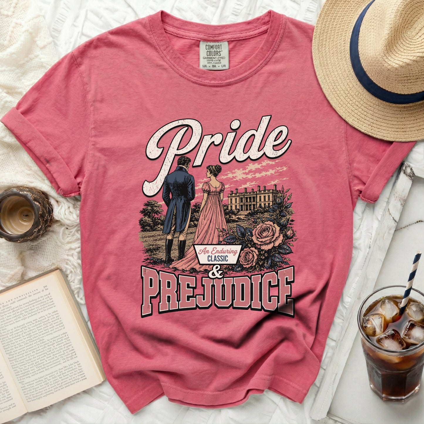 Pink t-shirt with "Pride & Prejudice" text and illustration.