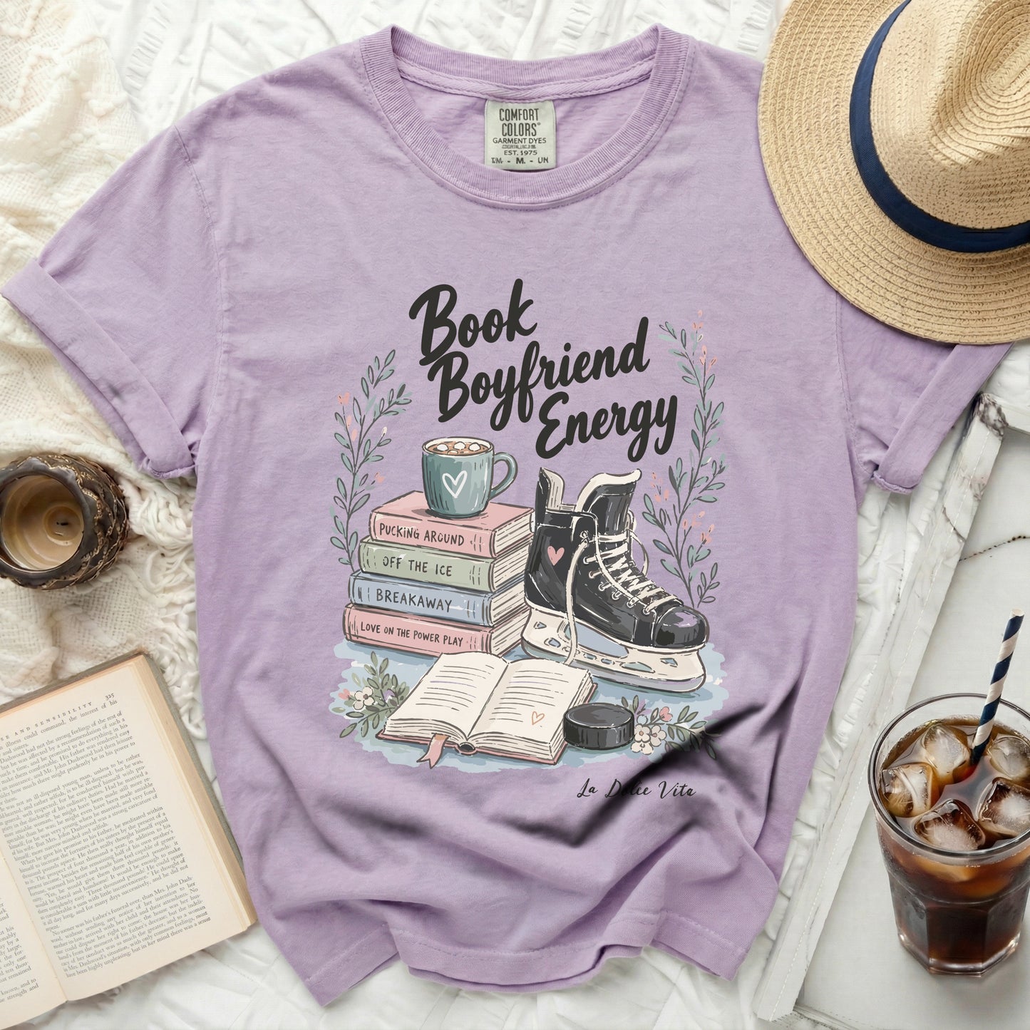 Purple t-shirt with "Book Boyfriend Energy" text and ice skates.