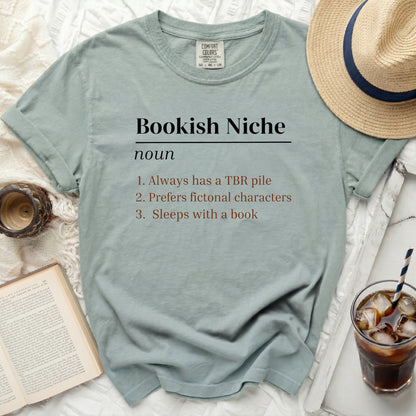 T-shirt with "Bookish Niche" definition: always has TBR pile, prefers fictional characters, sleeps with book.