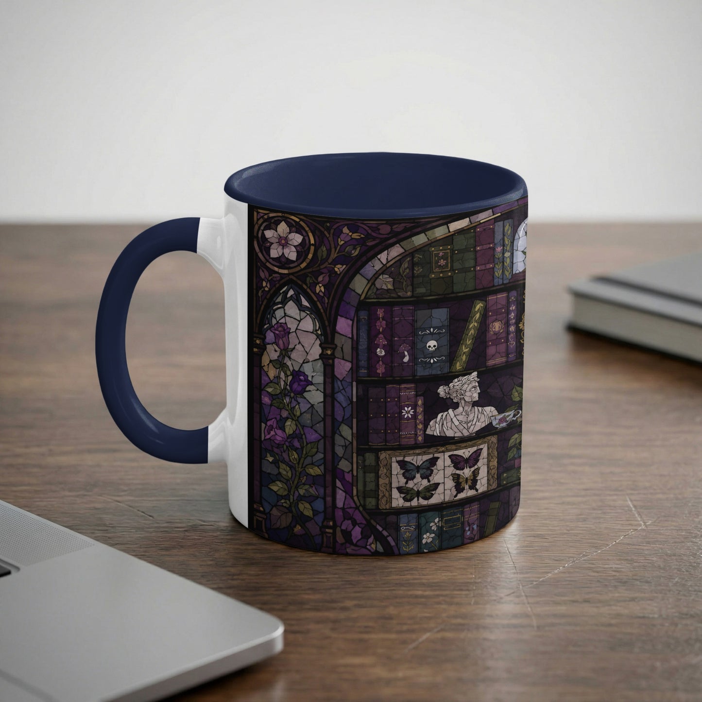 Mug with dark blue handle and interior, featuring a stained-glass design of a bookshelf.