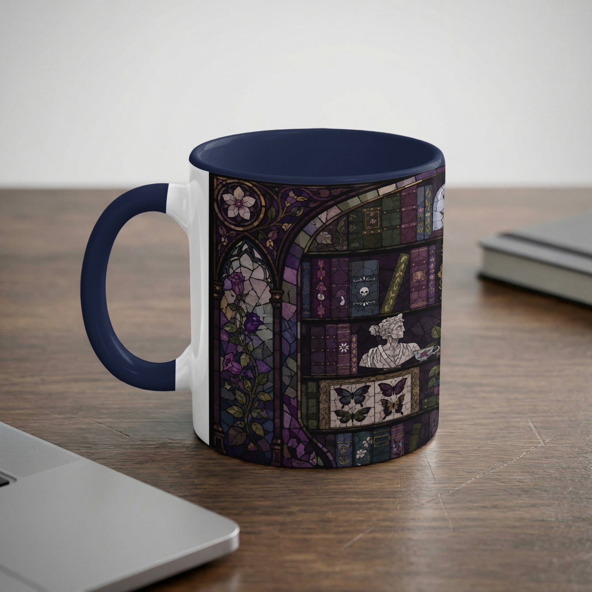Mug with dark blue handle and interior, featuring a stained-glass design of a bookshelf.