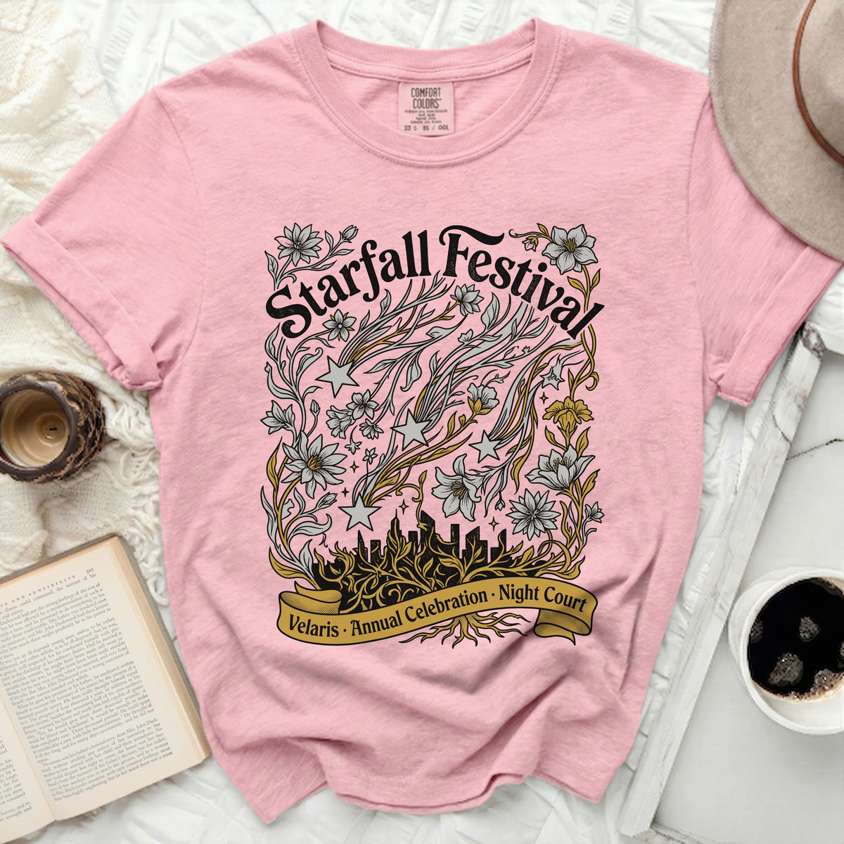 Pink t-shirt with "Starfall Festival Velaris Annual Celebration Night Court" design.