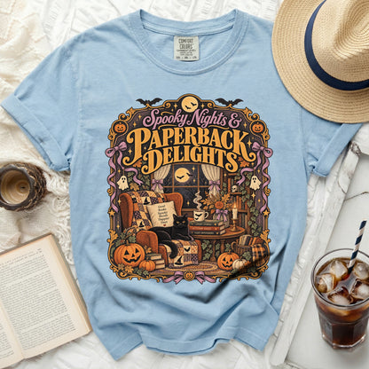 Light blue t-shirt with "Spooky Nights & Paperback Delights" Halloween graphic.
