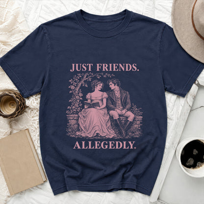 Navy t-shirt with pink text and vintage illustration of couple reading and saying "JUST FRIENDS. ALLEGEDLY."