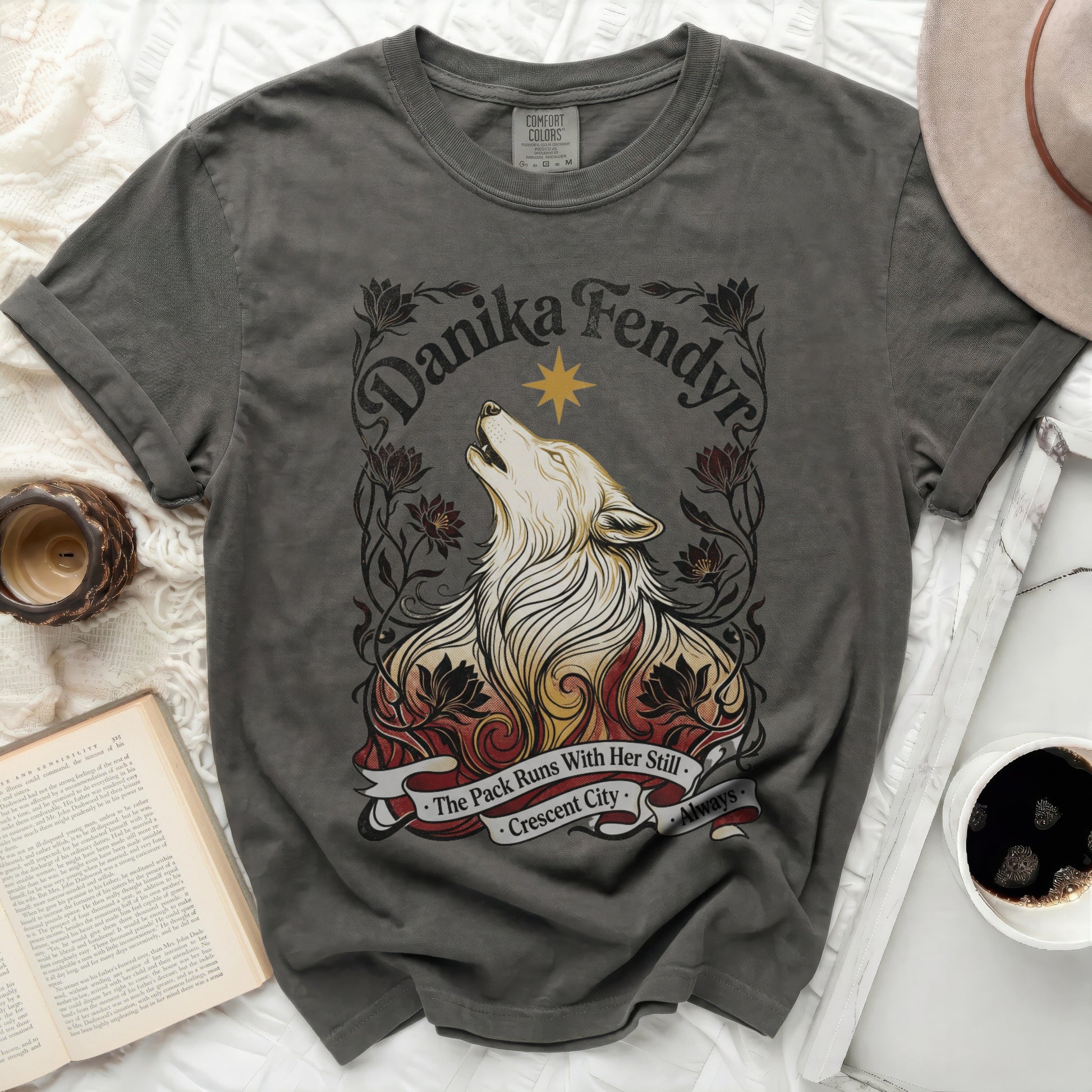 Dark grey t-shirt with wolf, flames, and text "Danika Fendyr The Pack Runs With Her Still Crescent City Always."