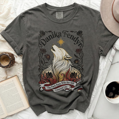 Dark grey t-shirt with wolf, flames, and text "Danika Fendyr The Pack Runs With Her Still Crescent City Always."