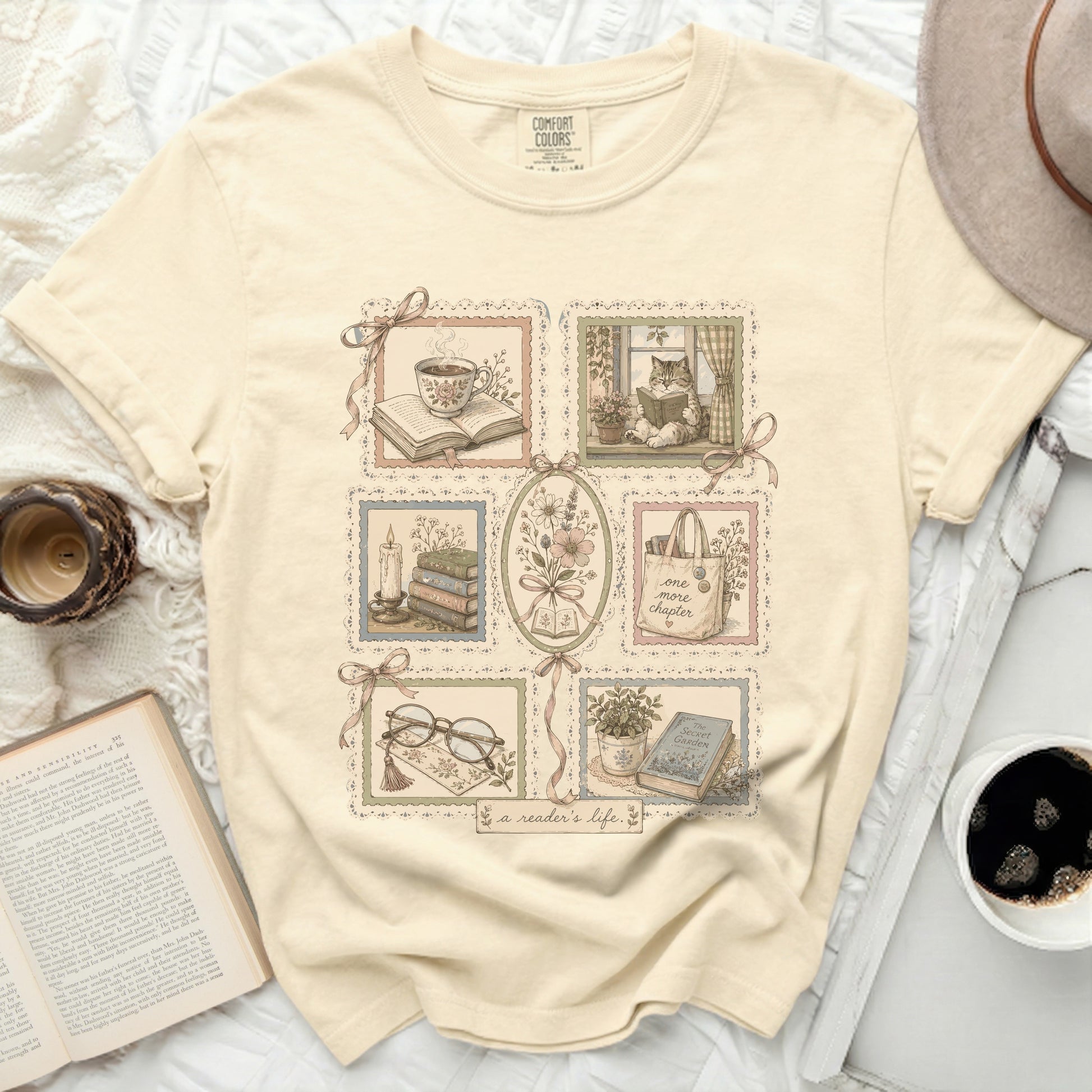 Cream t-shirt with framed literary illustrations and "a reader's life" text.