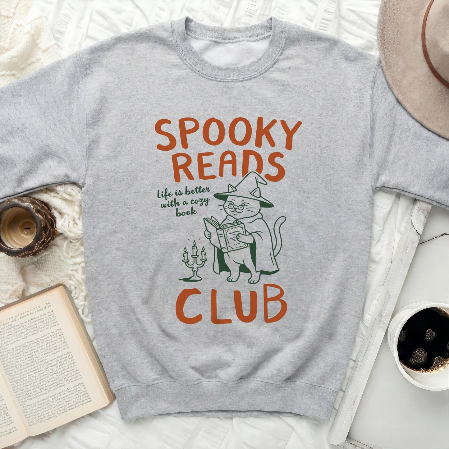 Grey sweatshirt with "Spooky Reads Club" text and cat graphic.