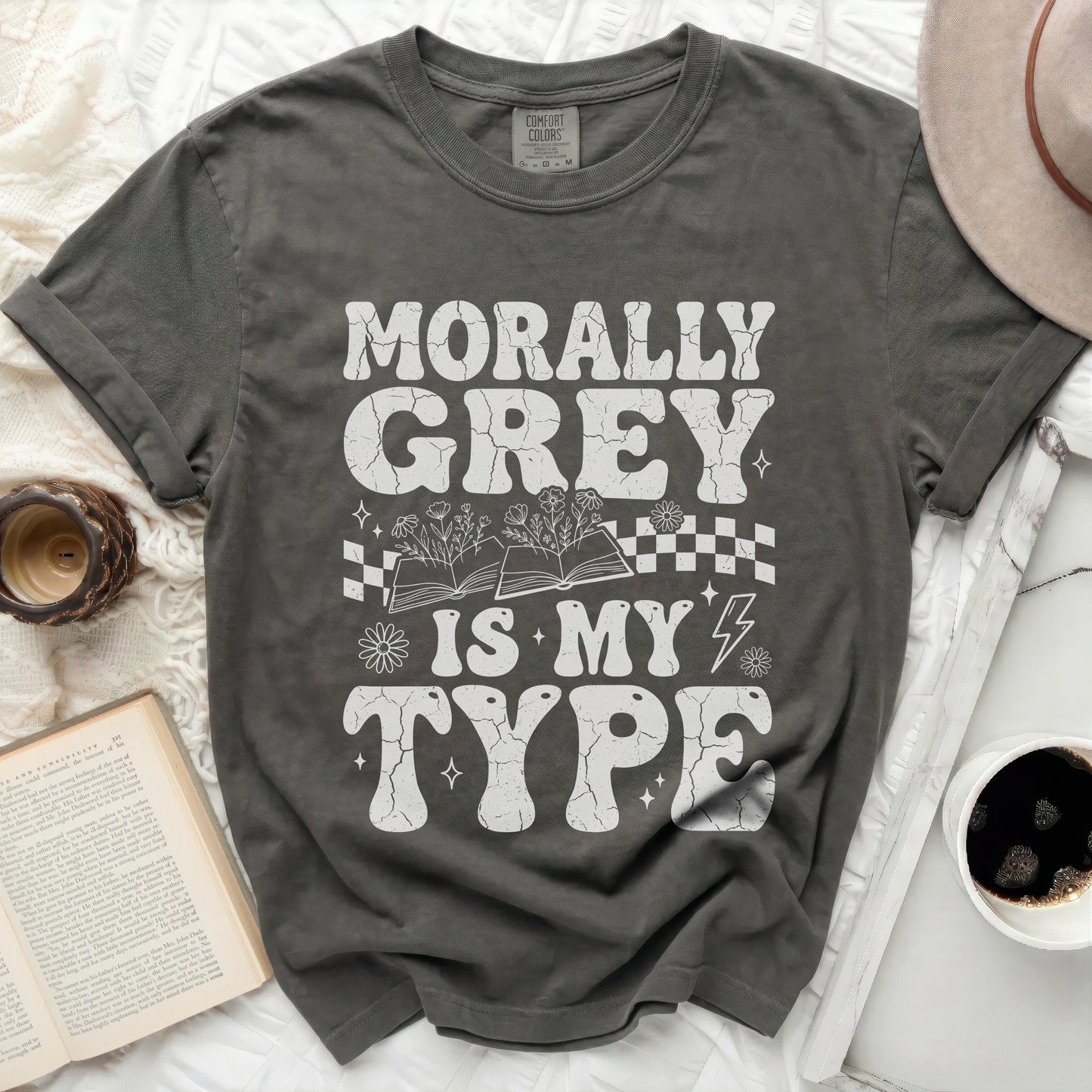 Morally Grey Is My Type graphic tee with books and flowers.