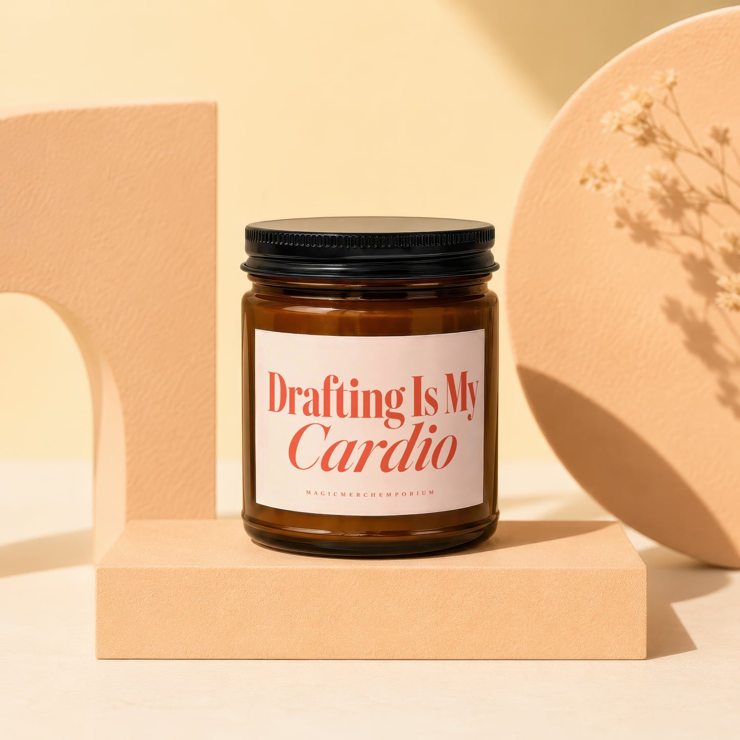 Amber jar candle with black lid, labeled "Drafting Is My Cardio MAGICMERCHEMPORIUM".
