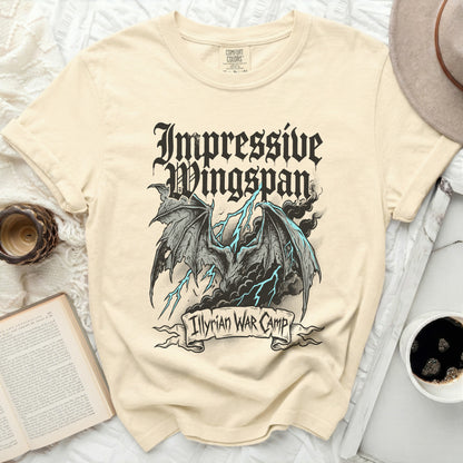 Cream t-shirt with gothic dragon graphic and "Impressive Wingspan" text.