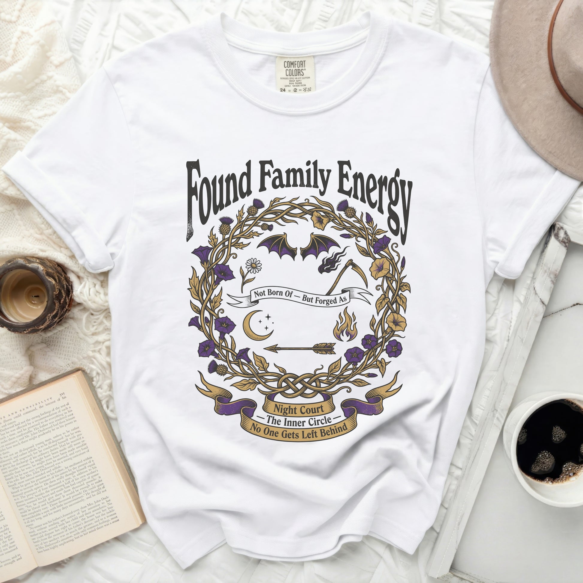 White t-shirt with "Found Family Energy Night Court The Inner Circle" graphic.