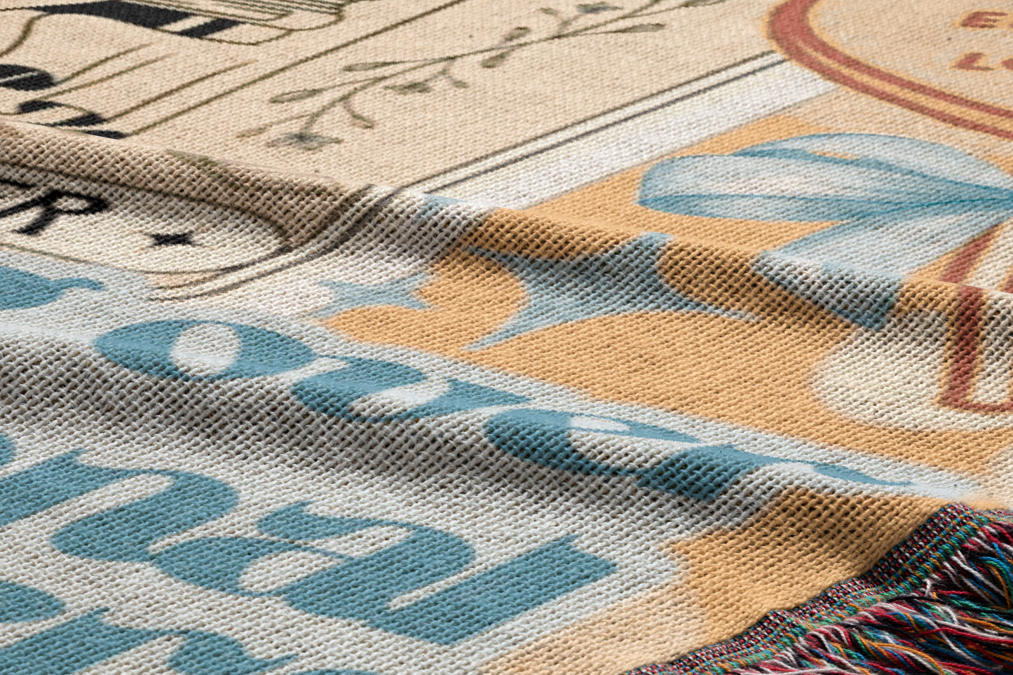 The image is a close-up of a textured fabric with various patterns and designs, including floral and geometric elements.