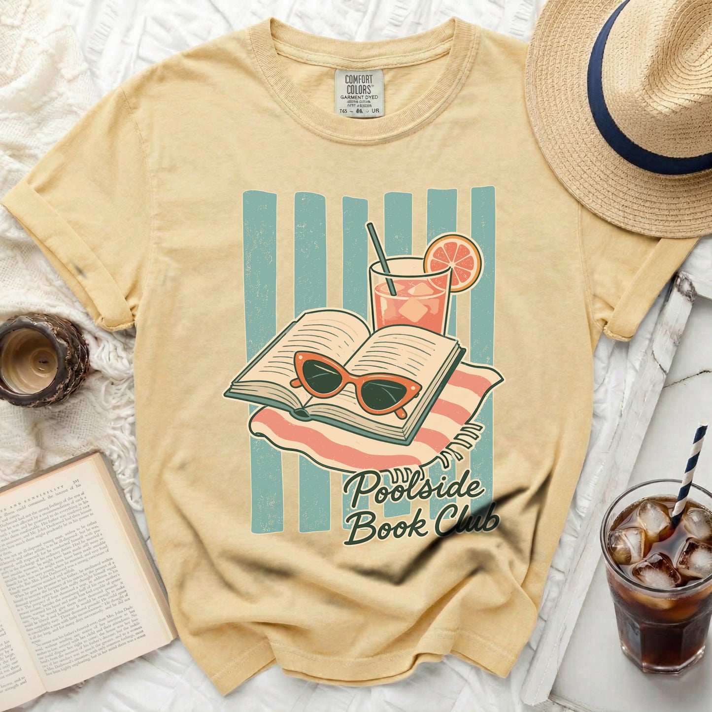 Yellow t-shirt with "Poolside Book Club" text and open book graphic.