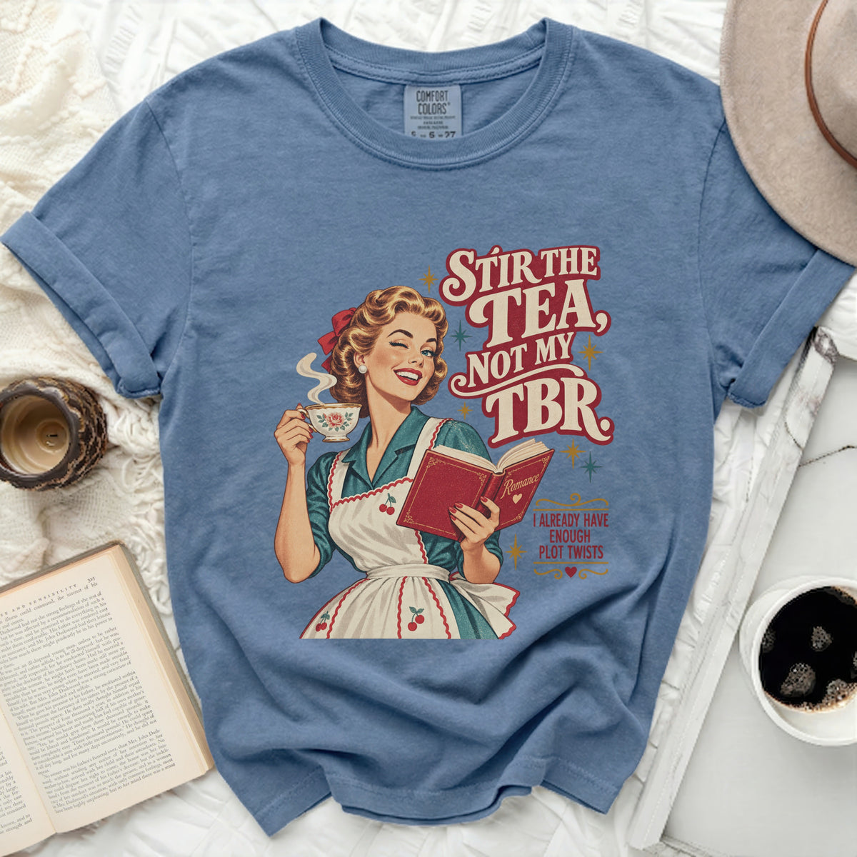 Retro woman holding tea and book with text "Stir the tea, not my TBR."