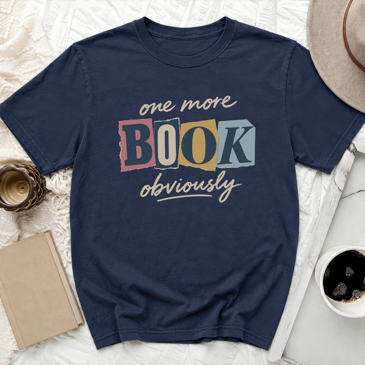 Navy t-shirt with "one more BOOK obviously" text design.