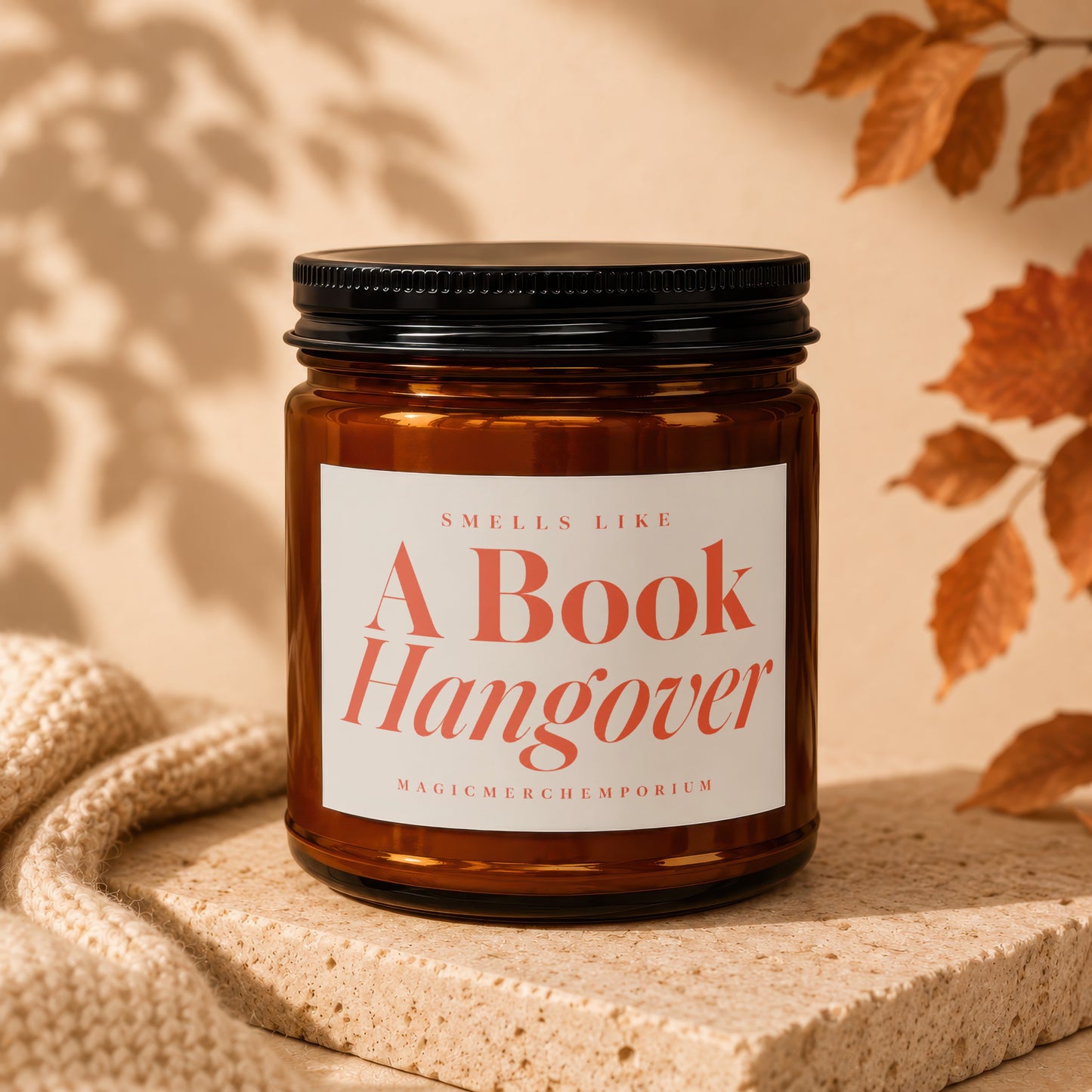 Amber glass candle labeled "Smells Like A Book Hangover" by MagicMerchEmporium.