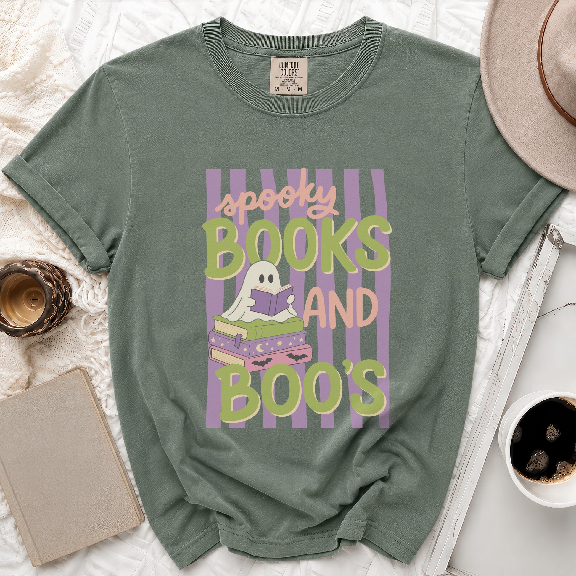 Green t-shirt with ghost reading books graphic and text "spooky BOOKS AND BOO'S".