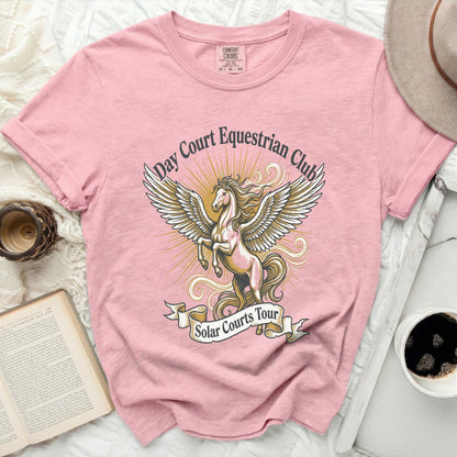 Pink t-shirt with a winged horse graphic and "Day Court Equestrian Club Solar Courts Tour" text.