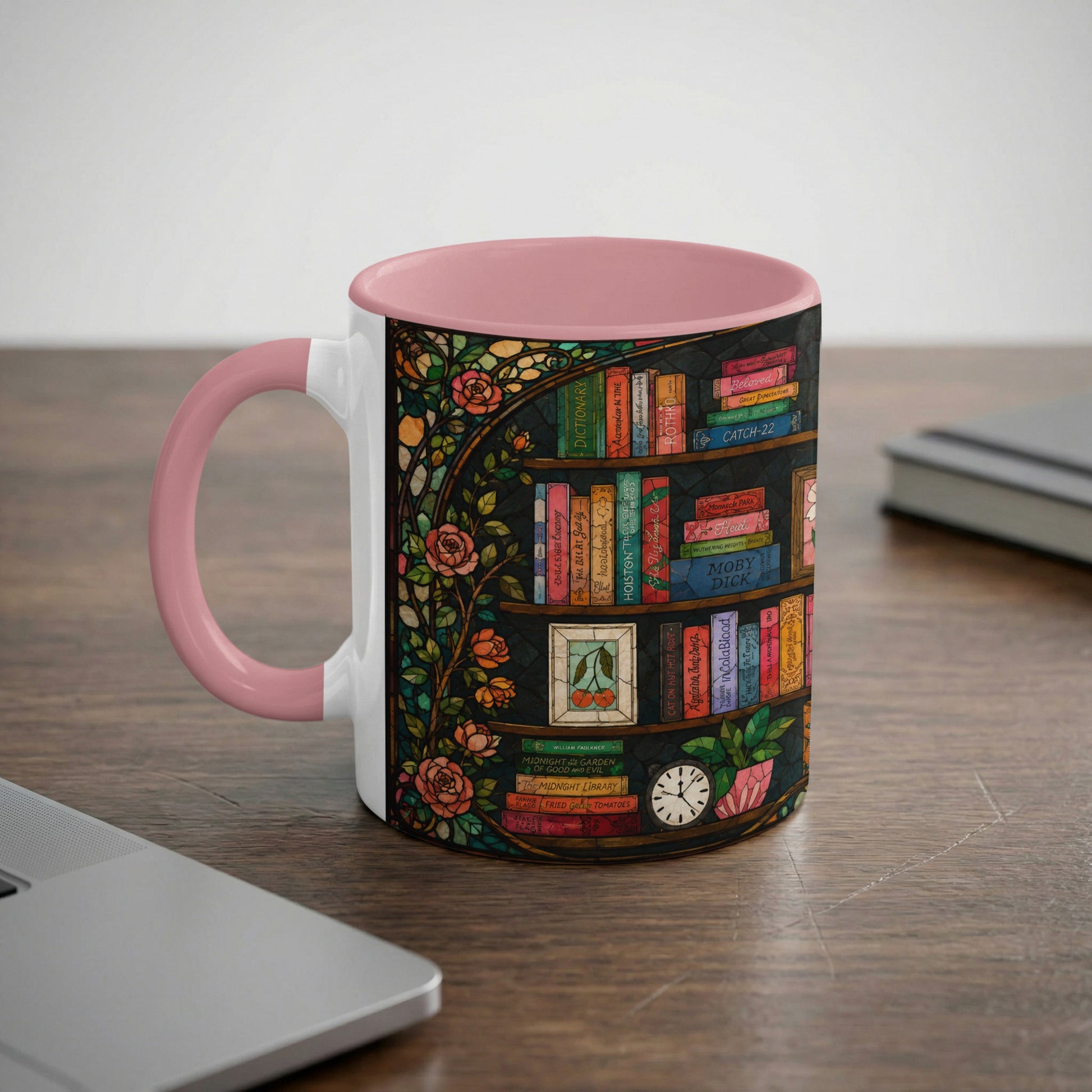 Mug with pink handle, featuring a stained glass bookshelf design with roses.