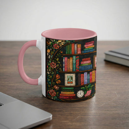 Mug with pink handle, featuring a stained glass bookshelf design with roses.