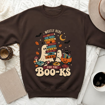 Brown sweatshirt with a graphic of ghosts, books, bats, and the text "Mostly Here For The Boo-Ks".