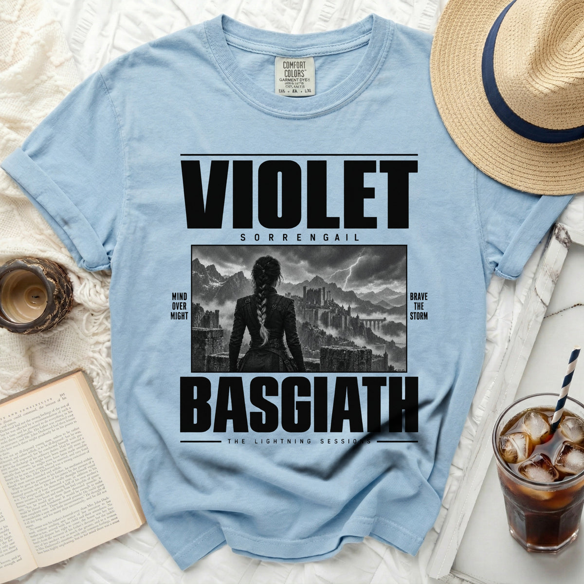 Light blue t-shirt with "VIOLET SORRENGAIL BASGIATH THE LIGHTNING SESSIONS" text and graphic.