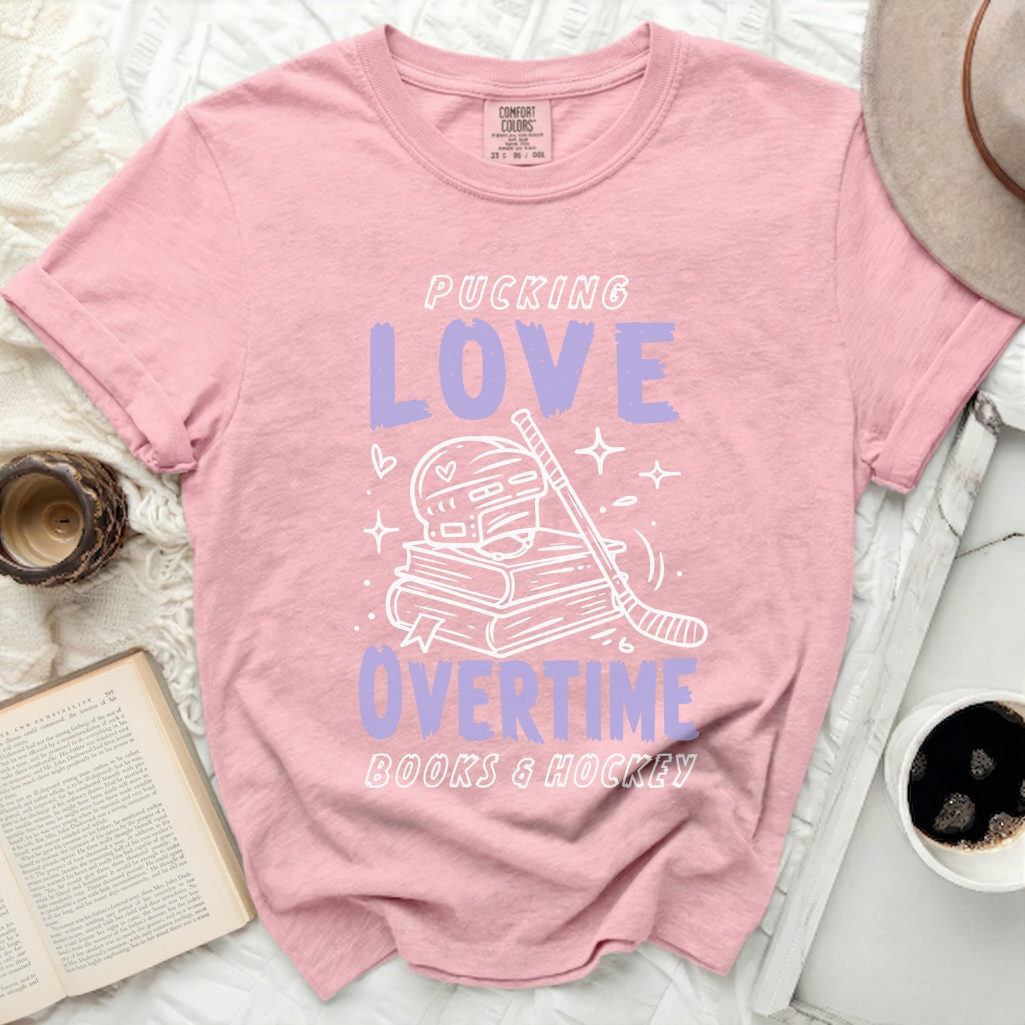 Pink t-shirt with "Pucking Love Books & Hockey" text and hockey graphics.