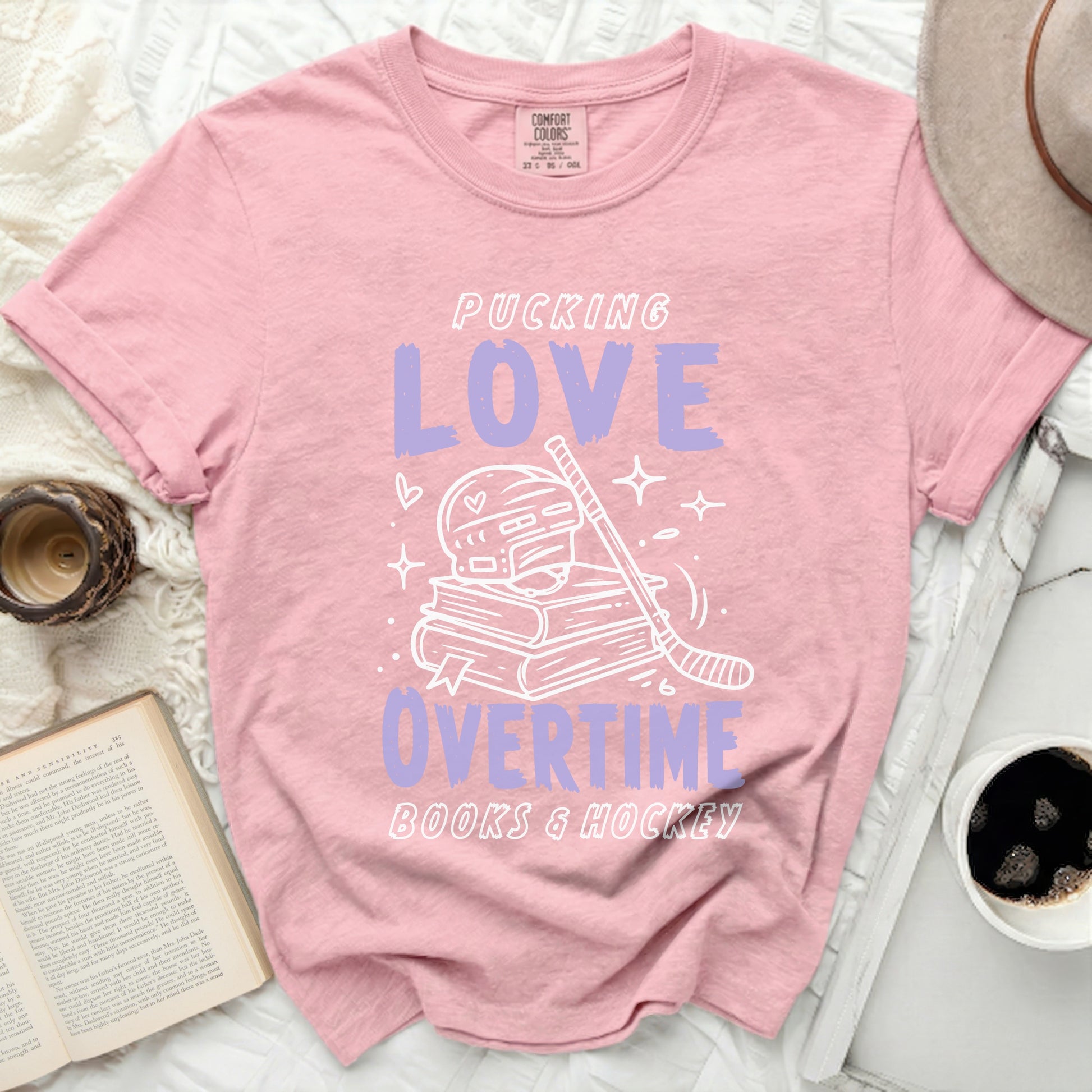 Pink t-shirt with "Pucking Love Books & Hockey" text and hockey graphics.