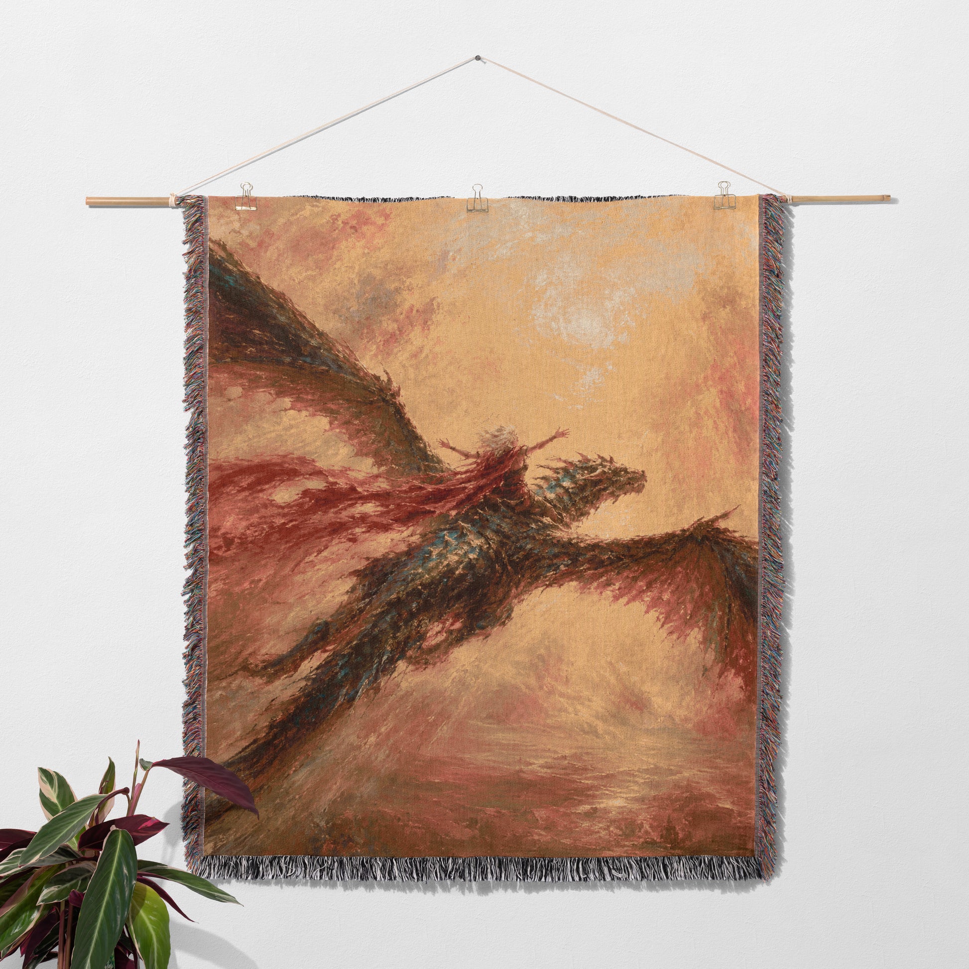 a large tapestry hanging on a wall, depicting a dragon-like creature with wings spread wide.