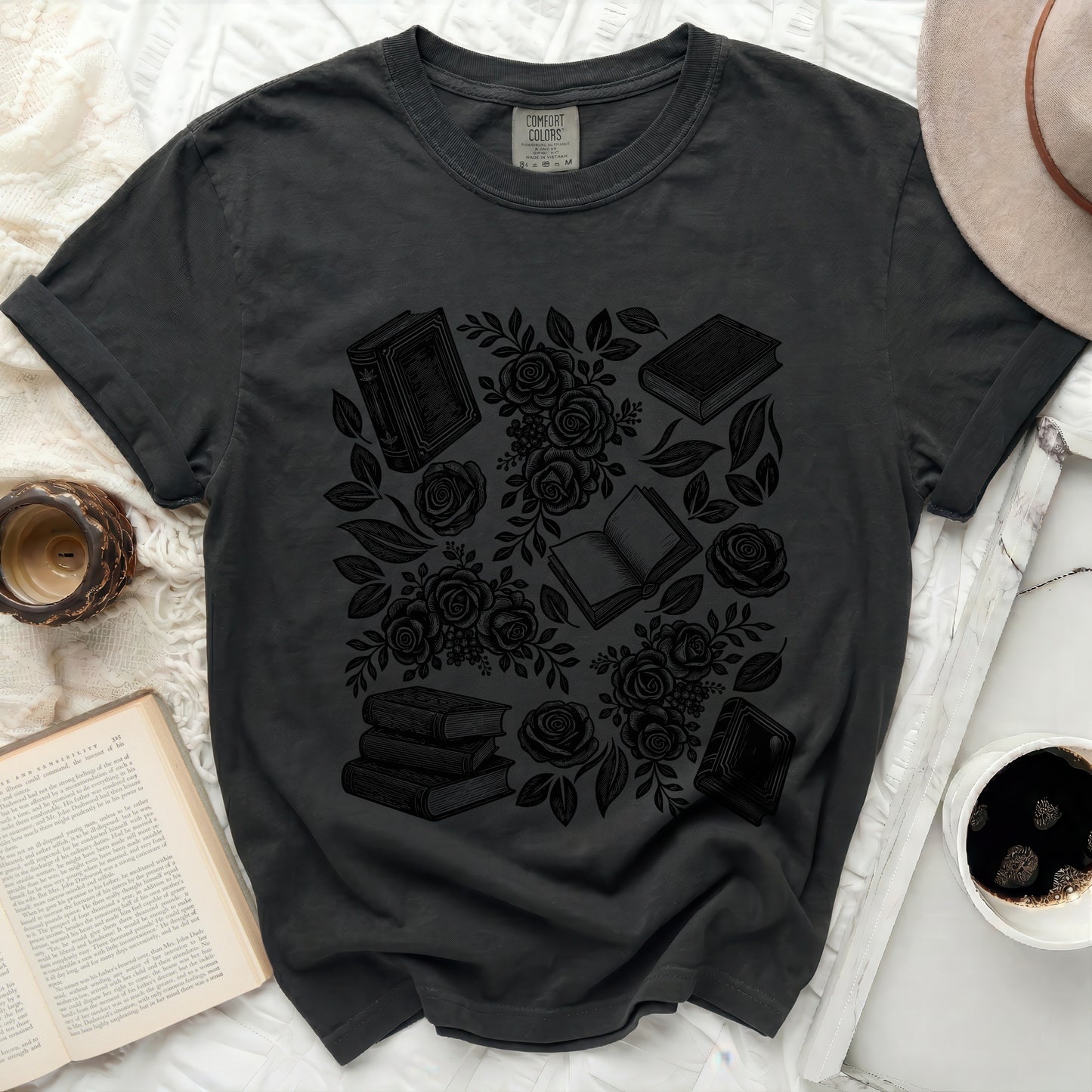 Charcoal t-shirt with a black line art design of books and roses.
