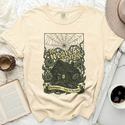 The Weaver's Cottage illustration with text on a cream t-shirt.