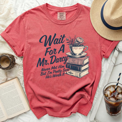 Salmon t-shirt with "Wait for a Mr. Darcy" graphic and literary imagery.