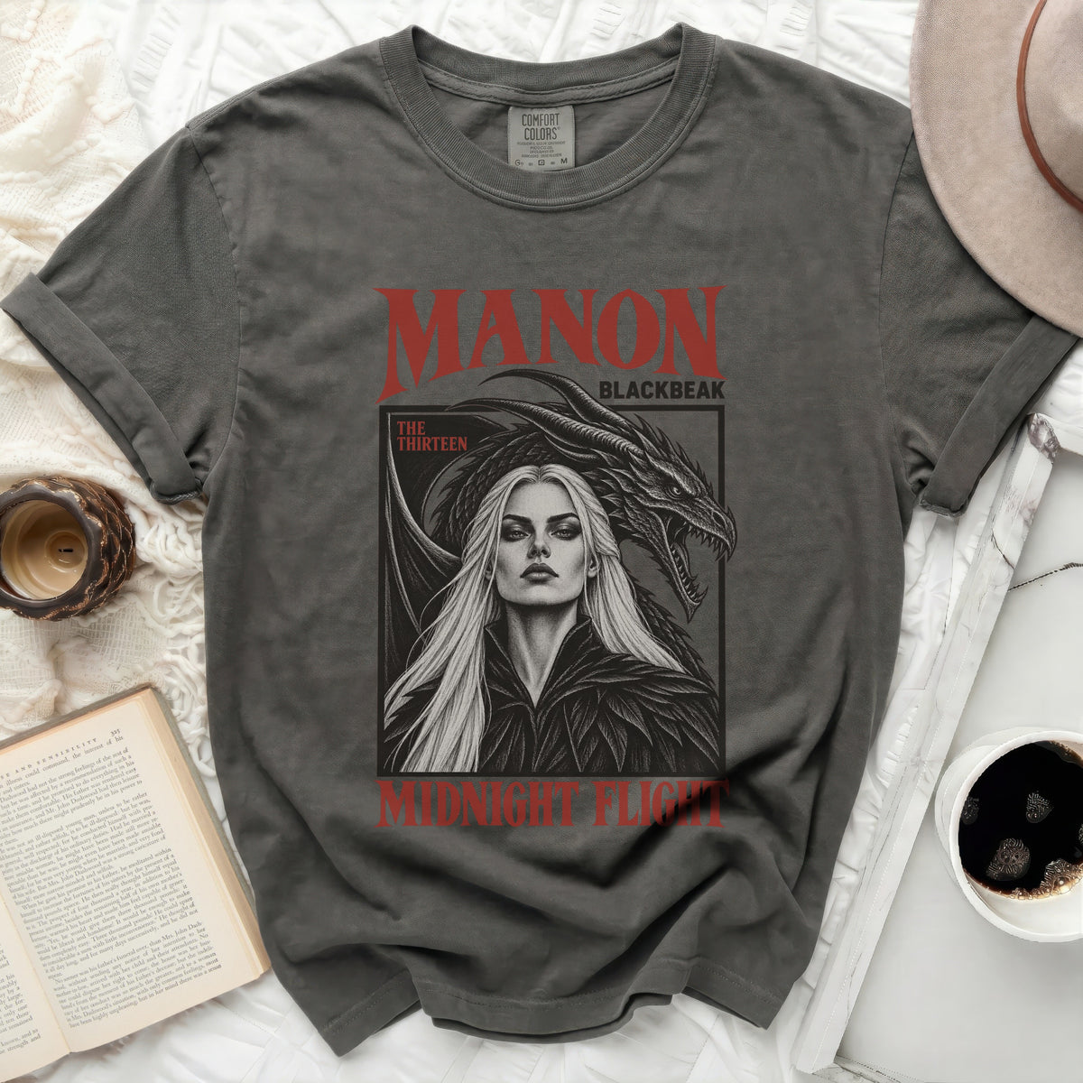 Grey t-shirt with Manon Blackbeak, a woman and dragon graphic.
