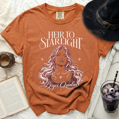 Orange t-shirt with "Heir to Starlight Bryce Quinlan" graphic and a woman's portrait.