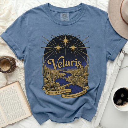 Blue t-shirt with "Velaris The City of Starlight" graphic and starry sky.