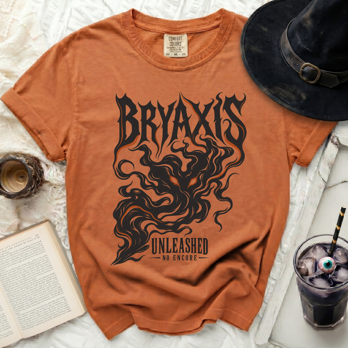 Orange t-shirt with black "BRYAXIS UNLEASHED NO ENCORE" graphic.