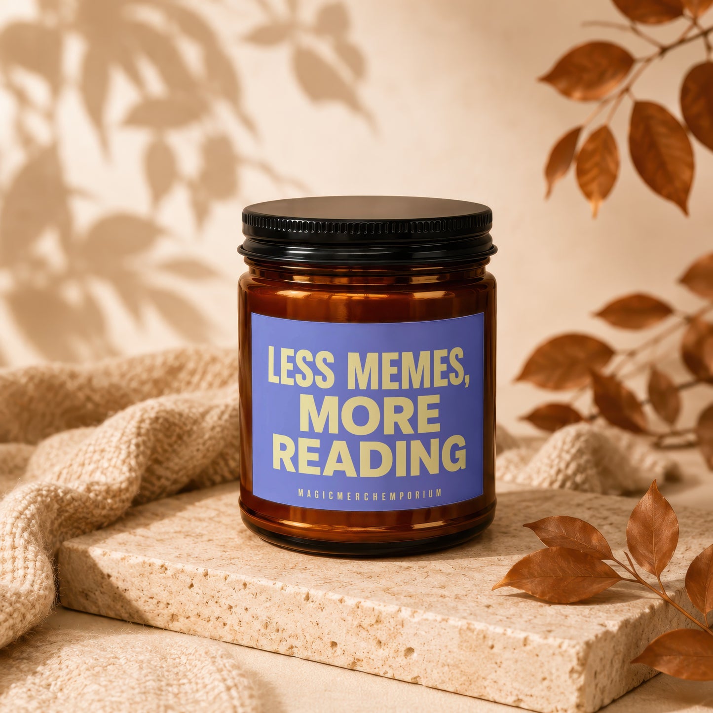 Amber jar candle with label reading "LESS MEMES, MORE READING" and "MAGICMERCHEMPORIUM".