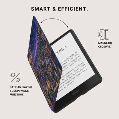 Kindle e-reader with a decorative cover displaying a starry night cityscape and text.