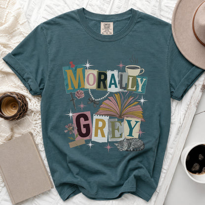 Teal t-shirt with "MORALLY GREY" text collage, cat, and book.