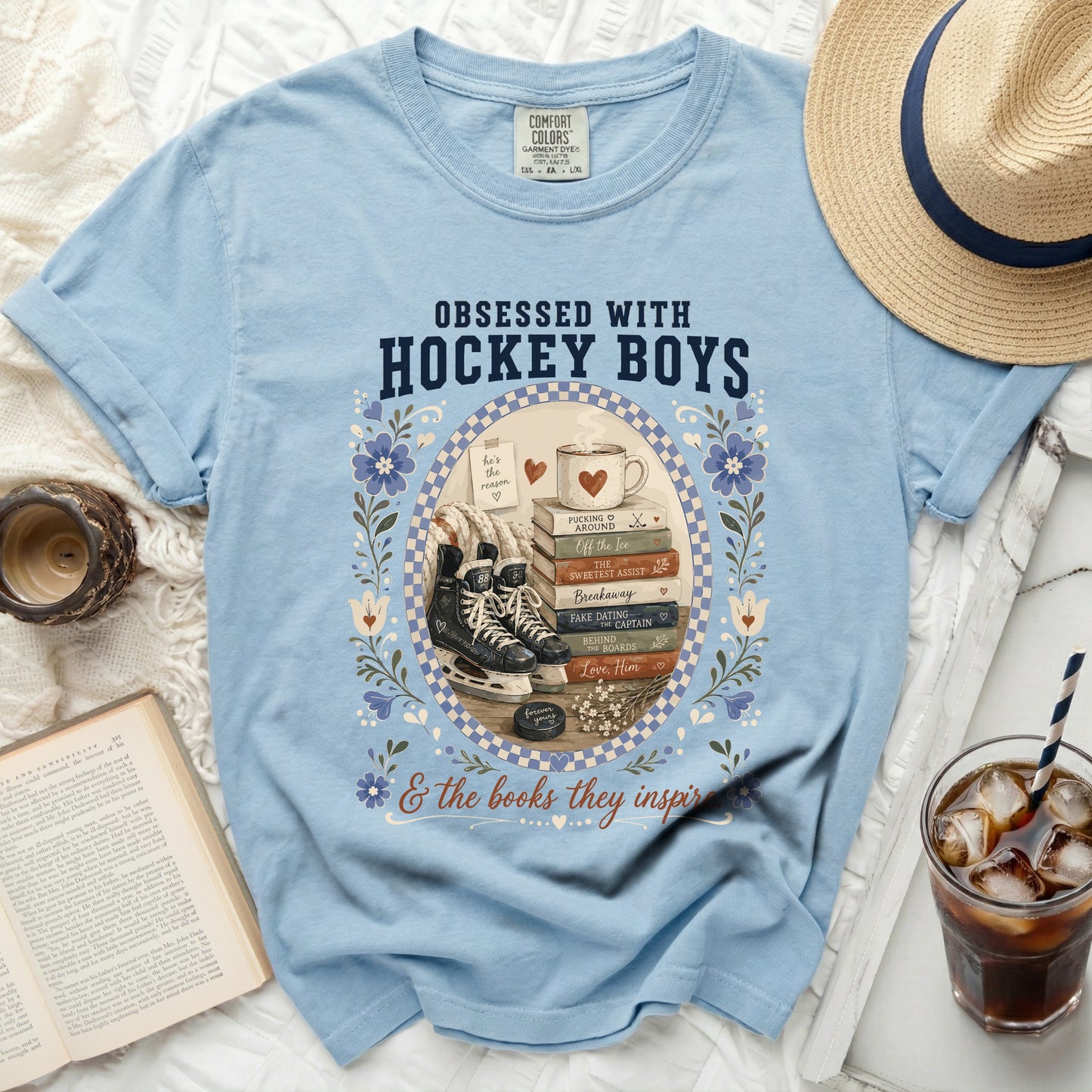 Light blue t-shirt with "Obsessed With Hockey Boys" and book graphics.