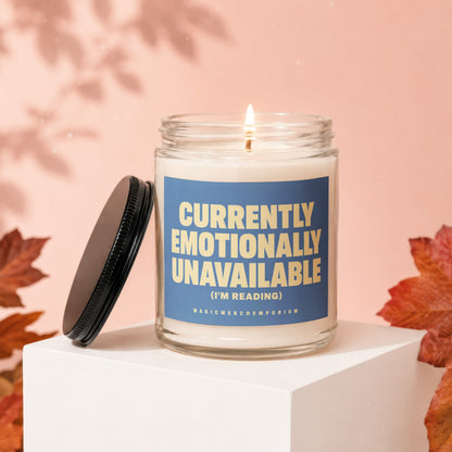 Candle with blue label reading "Currently Emotionally Unavailable (I'm Reading)".