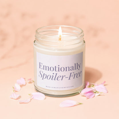Glass jar candle with lit wick, label reads "Emotionally Spoiler-Free".
