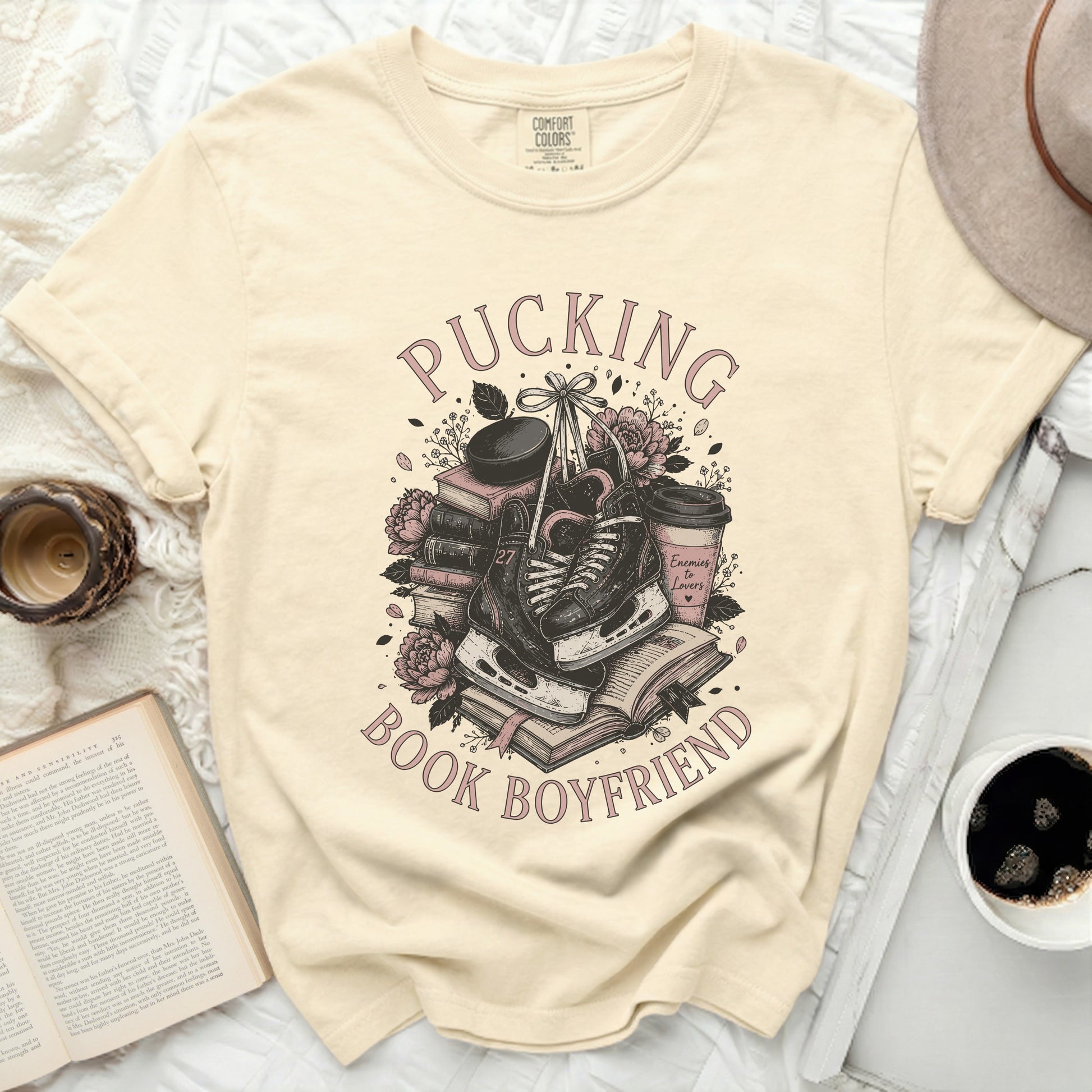 T-shirt with "Pucking Book Boyfriend" text and hockey ice skates.