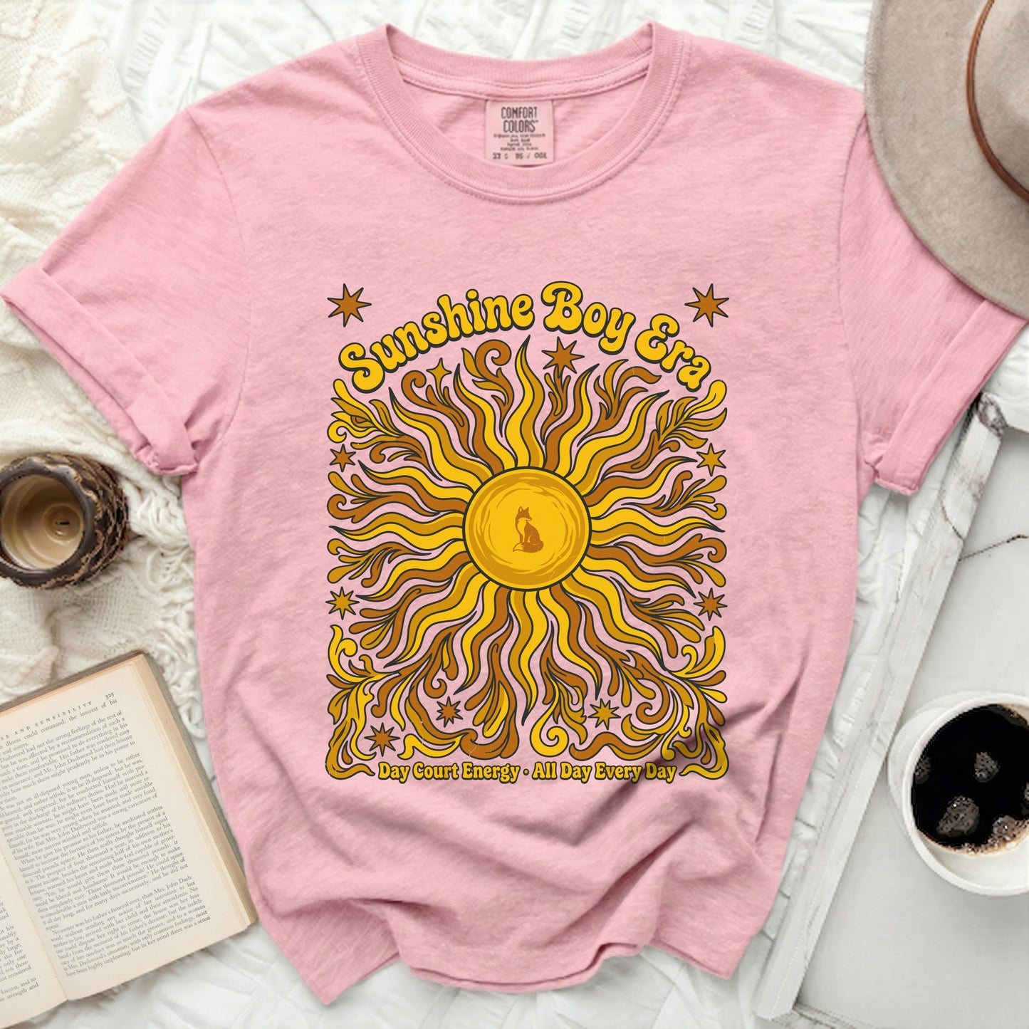 Pink t-shirt with "Sunshine Boy Era" and sun graphic.