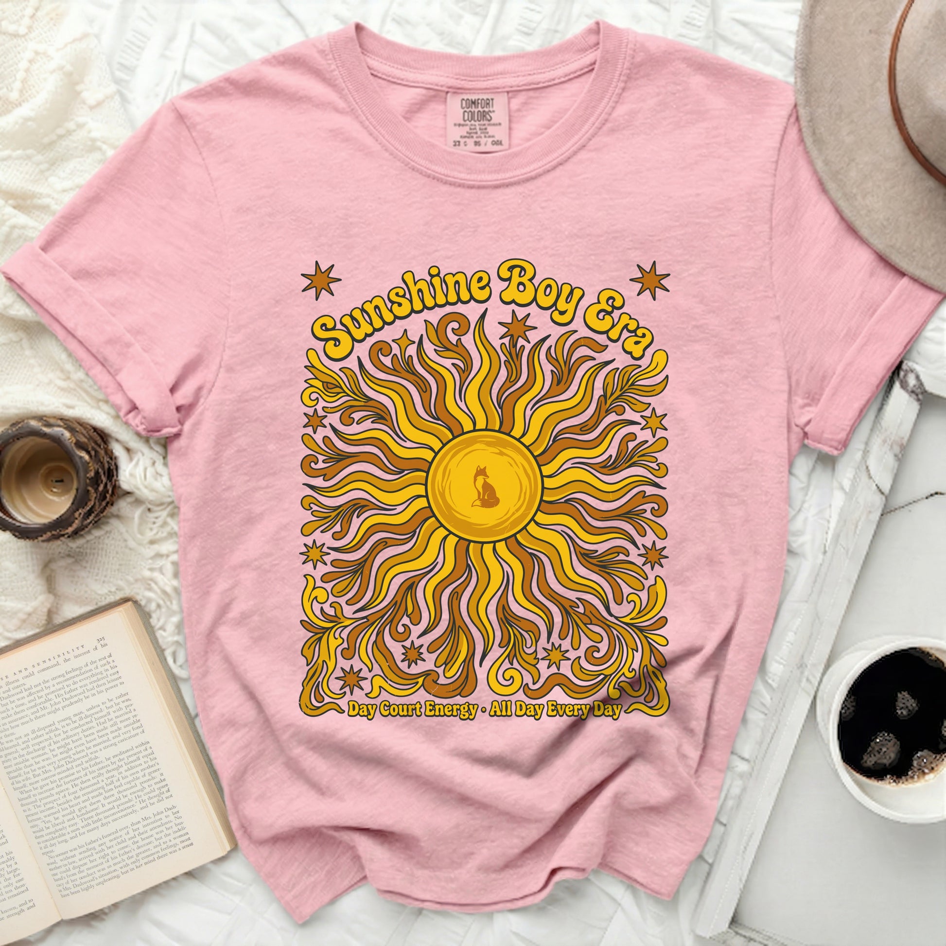 Pink t-shirt with "Sunshine Boy Era" and sun graphic.