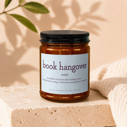 Amber jar candle with "book hangover" definition label.